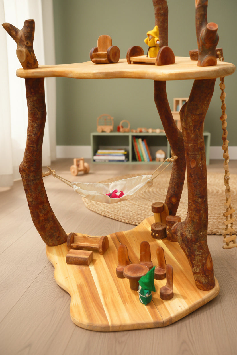 Wooden cat tree with platforms, a hammock, and toys on a white background
