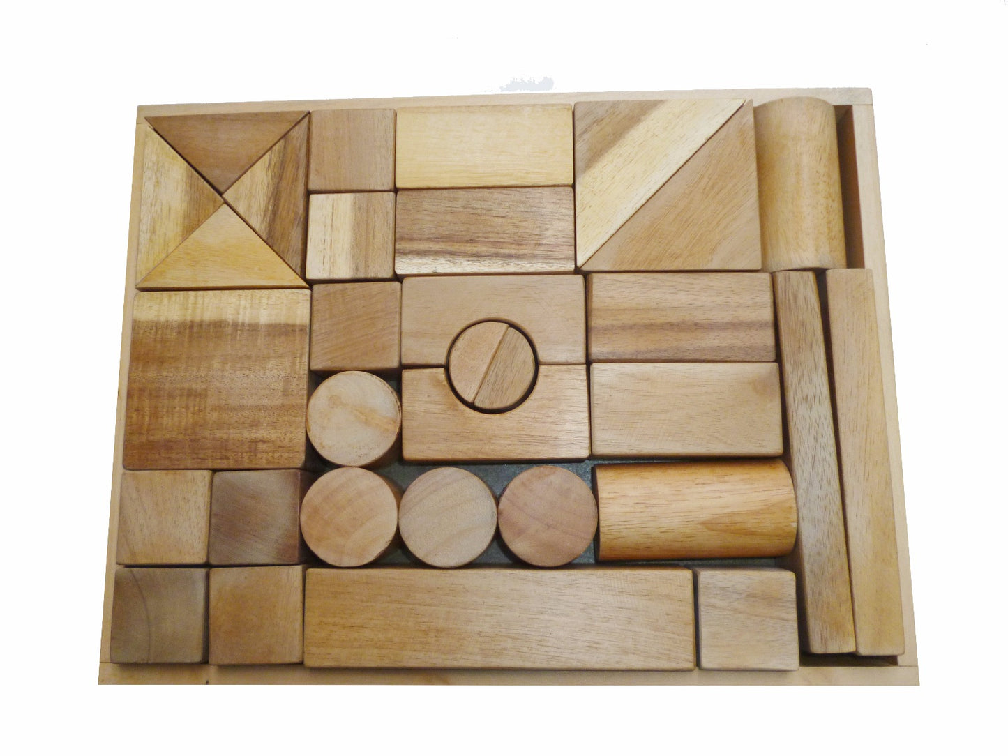 Set of wooden building blocks in various shapes and sizes on a white background