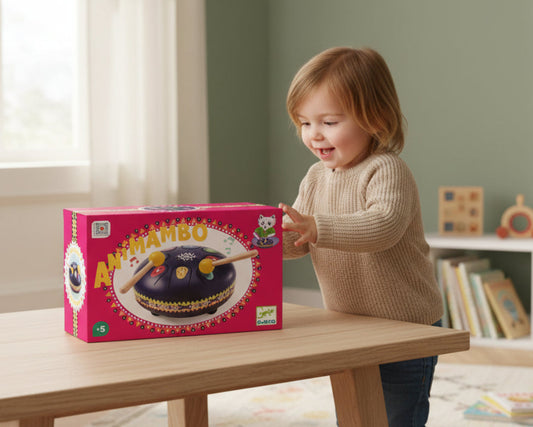 Toy drum set with two mallets on a pink box featuring 'Antimambo' and Djeco branding.