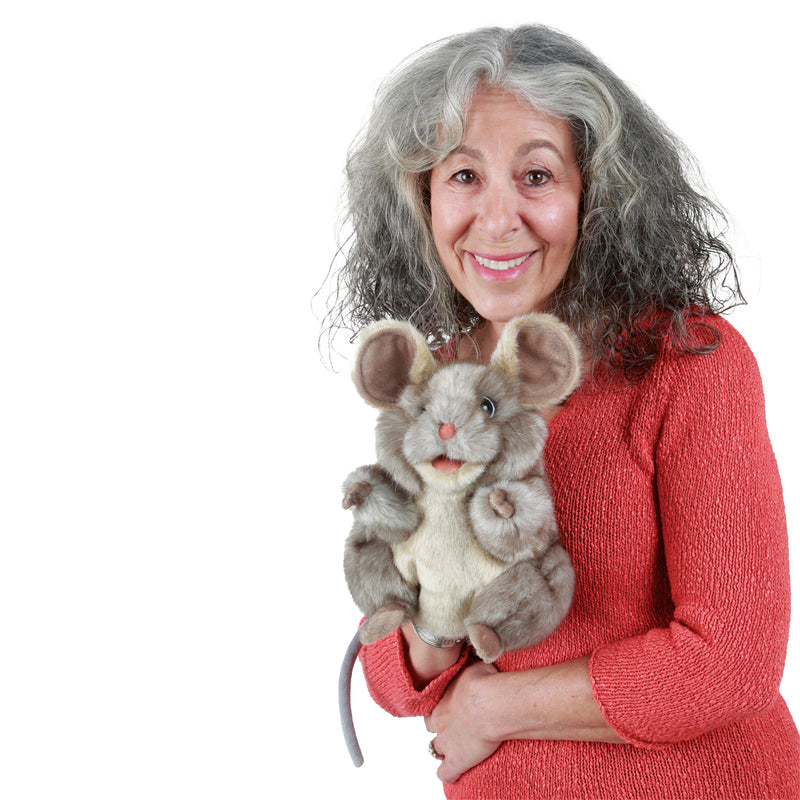 Woman holding a plush mouse toy against a white background