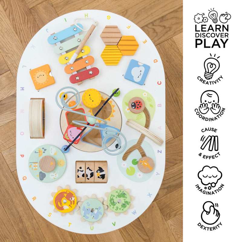 Colorful children's toys on a round play mat with educational icons on the side.