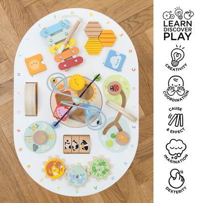 Colorful children's toys on a round play mat with educational icons on the side.