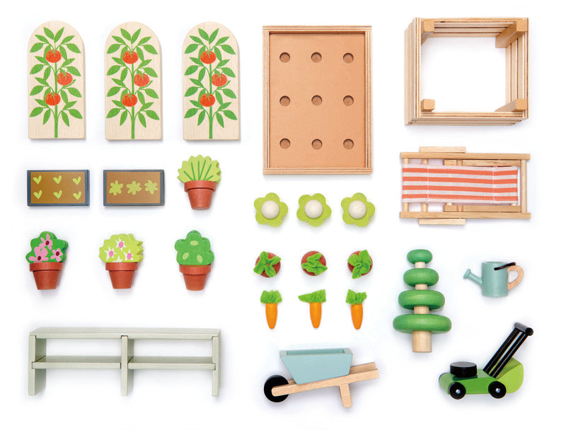 Set of wooden gardening toys including plants, tools, and a bench on a white background