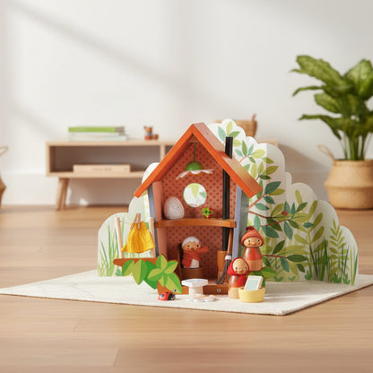 Wooden toy set with a small house and characters on a white background