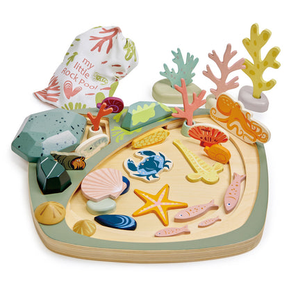 Wooden ocean-themed puzzle with colorful sea creatures and coral on a white background