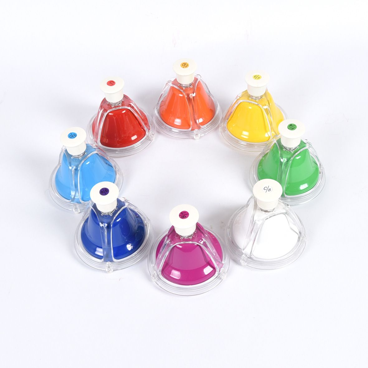 Set of colorful plastic cups with white lids on a white background