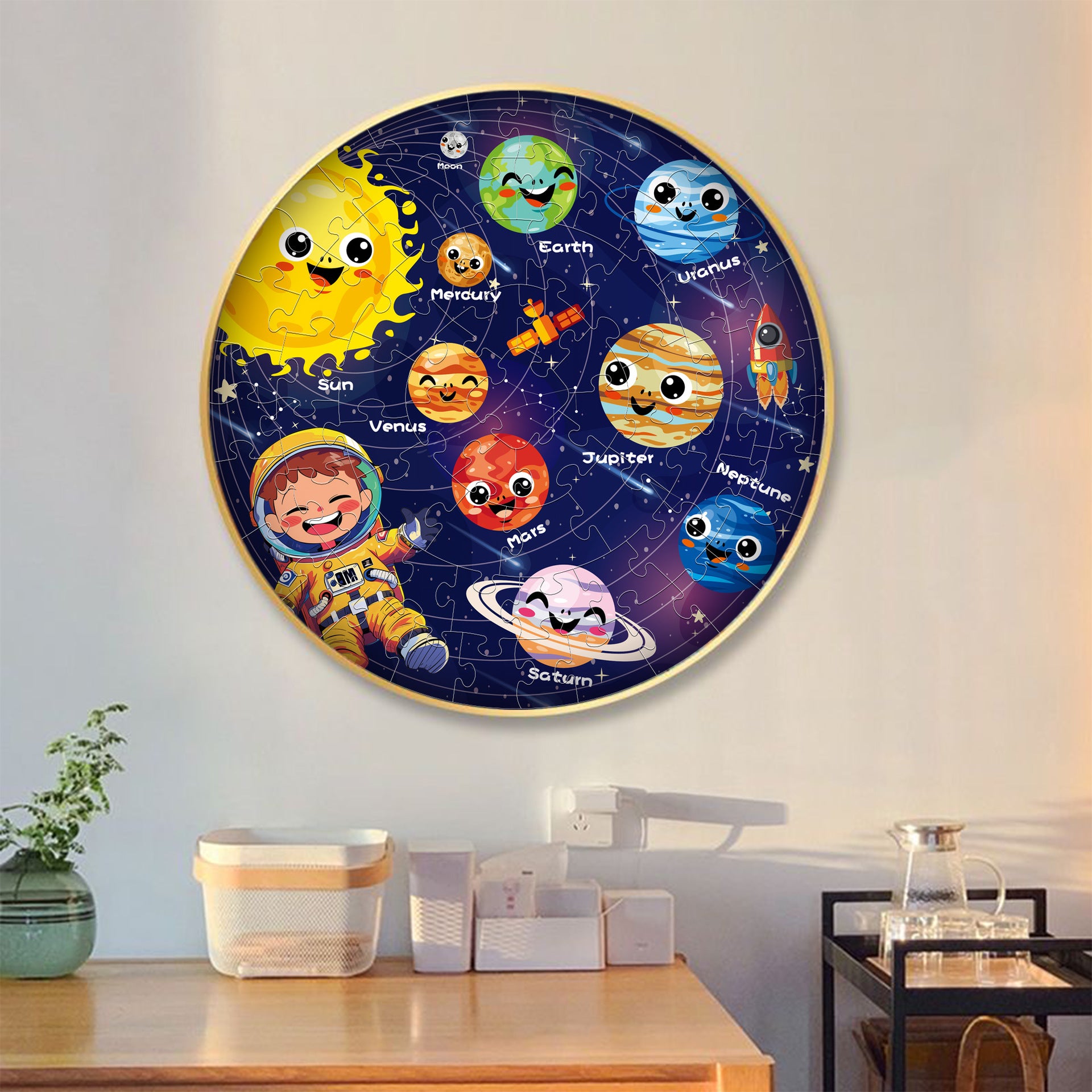 Children's solar system wall chart with cartoon planets and an astronaut on a white wall.